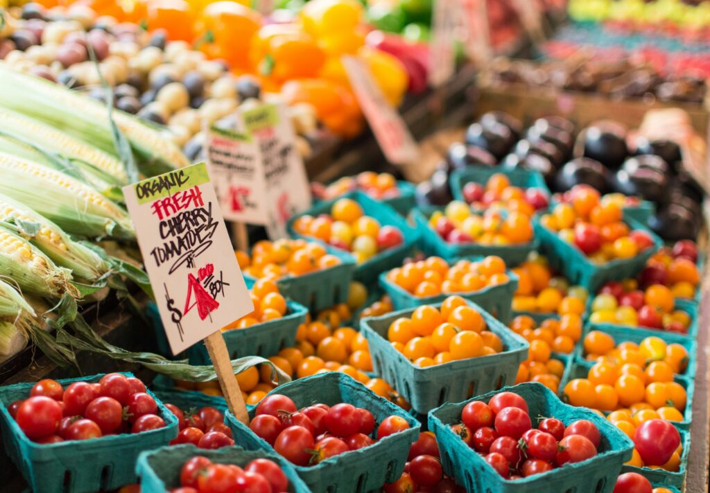 picture of cherry tomatoes, eggplant, corn and more locally grown food